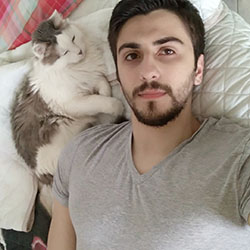 A candid photo of Andrea holding Ciorts the cat